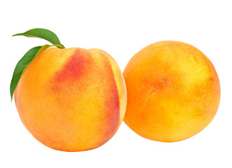 ripe peach fruits with green leaves isolated on white background