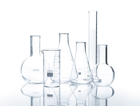 Six empty laboratory flasks with reflection