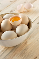 eggs in a bamboo cup on a wooden board