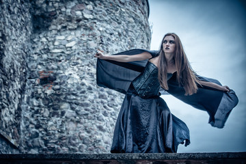 Naklejka premium Portrait of a young witch. Halloween, horror.