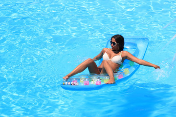 Woman Relaxing in a pool