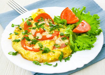 Omelet with tomatoes and green onions