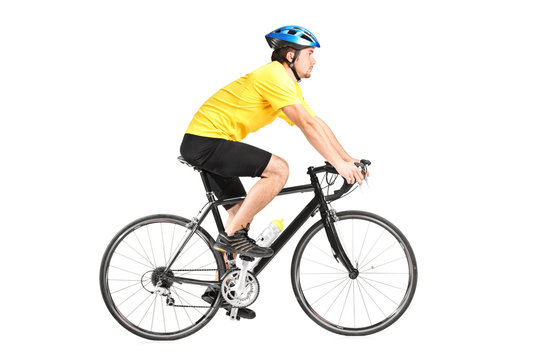 Full length portrait of a man riding a bycicle