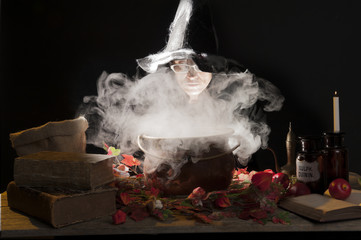halloween witch with cauldron