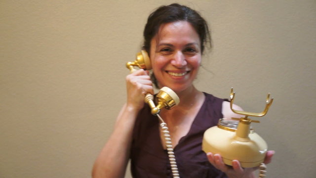 Woman on an Old Retro Style Telephone