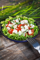 Fresh salad with tomatoes and cucumbers.