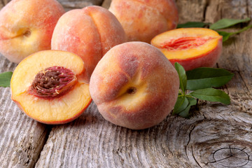 fresh peaches on wood  background