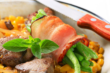 Sweetcorn with fried chicken liver and green beans in bacon