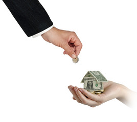 Money home in hand isolated on white background