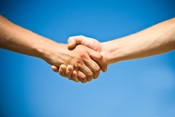 Shaking hands of two business people