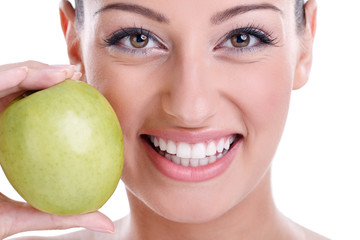 healthy teeth and green apple