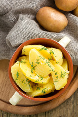 Boiled potatoes with dill and butter