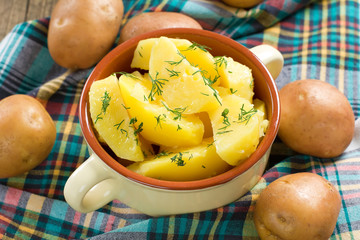 Boiled potatoes with dill and butter