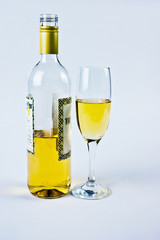 bottle with a glass of white wine