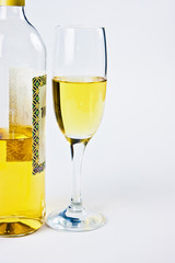 bottle with a glass of white wine