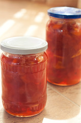 Fototapeta na wymiar cooked fresh homemade apple jam in the jar