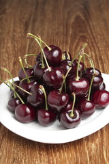 Red Cherries on White Dish