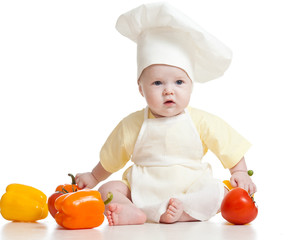 cute baby boy chef with healthy  food vegetables, isolated on wh