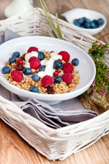 muesli with raspberries and blueberries for a healthy breakfast © Kamila Cyganek