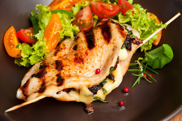 grilled fillet of chicken stuffed with mozzarella and mushrooms