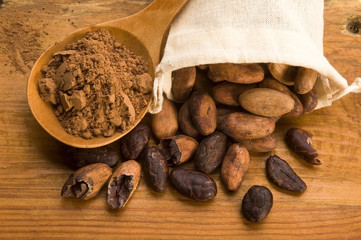 Cocoa (cacao) beans on natural wooden table