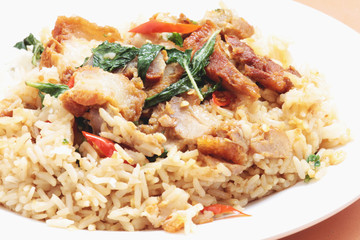rice topped with stir fried crispy pork and holybasil