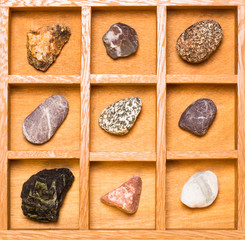Shadow box with collection of rocks