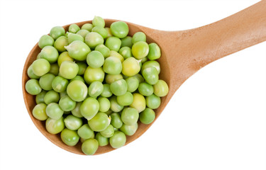 Green peas in wooden spoon