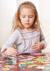 Girl playing puzzle