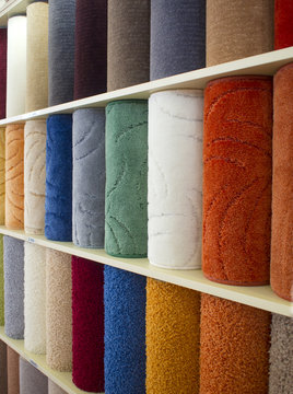 colorful carpets samples on the shelves