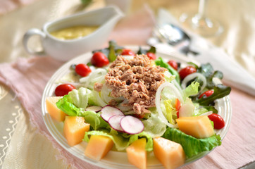 Fresh salad from vegetables, cheese and tuna