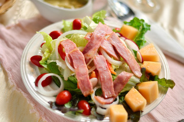 Fresh salad from vegetables, cheese and ham