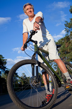 senior man with bicycle