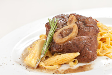 tasty steak with pasta