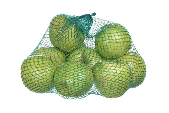bag of green apples isolated on white