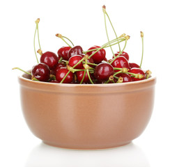 Ripe cherry berries in bowl isolated on white