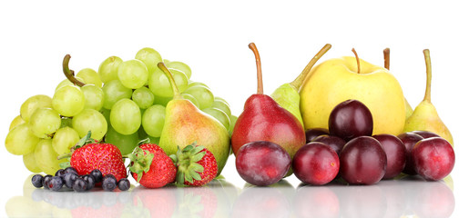 Mix of ripe sweet fruits and berries isolated on white