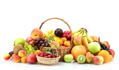 Assortment of exotic fruits and berries in baskets isolated