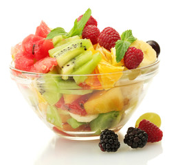 fresh fruits salad in bowl  and berries, isolated on white