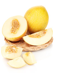 Ripe melons on wicker cradle isolated on white