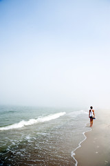 Woman On Walk By The Sea