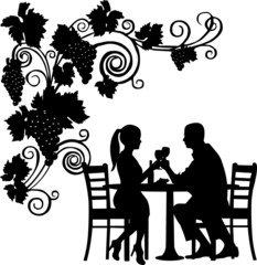 Background with grapes and romantic couple in restaurant