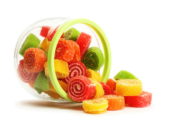 colorful jelly candies in glass jar isolated on white.