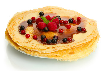 Delicious pancakes with berries and chocolate