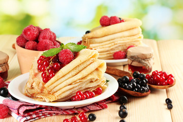 pancakes with berries, jam and honey