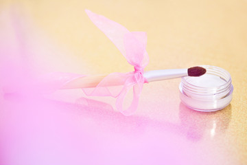 eyeshadow and makeup brush with bow