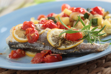 Fototapeta na wymiar Baked sea bass with vegetables