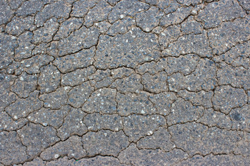 Macro closeup on concrete asphalt cracks on the road