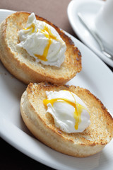 Egg Benedict without ham on white plate