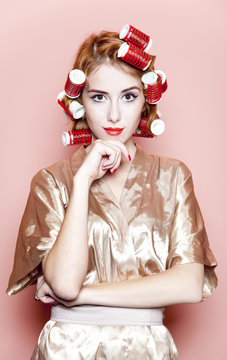 Redhead girl with curlers